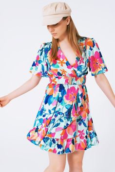 Introducing our Belted Soft Satin Dress with Flower Print, a chic and playful addition to your wardrobe. This cropped-length dress features a delightful floral print, adding a touch of charm and femininity to your look. Designed with a classic V-Neck and short sleeves, this dress strikes the perfect balance between comfort and style. Its relaxed fit ensures a casual and laid-back feel, making it ideal for various occasions.  The dress comes with a belt made of the same fabric, allowing you to cinch it at the waist and create a flattering silhouette. The soft satin material lends a luxurious sheen and a smooth touch, enhancing the overall elegance of the dress.  Crafted with a cross-front design, the dress is made of 100% polyester, ensuring durability and a graceful drape. Our model is wea Versatile Dresses, Wardrobe Style, Knitwear Tops, Satin Material, Satin Dress, Polo Collar, Belted Dress, Alternative Fashion, Flower Print