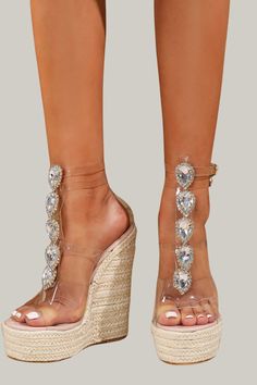 Indulge in the ultimate luxury with these Women's High Heel Sandals adorned with sparkling rhinestone chains. Featuring a jute sole and transparent heel, these sandals exude a bold and fashionable vibe. Perfect for any vacation, these sandals have an open toe design, a simple yet elegant pattern, and an ankle strap for added support. The wedge heels measure an ultra high 15cm/5.9 inches, while the upper and lining materials are made of premium PVC. Step out in style and comfort with these exclus Glamorous Sandals With Clear Strap And Open Toe, Glamorous Open Toe Sandals With Clear Strap, Glamorous Clear Open Toe Sandals, Embellished Crystal Sandals, Glamorous High Heel Wedge Sandals With Rhinestones, Glamorous Rhinestone High Heel Wedge Sandals, Glamorous Party Sandals With Clear Strap, Glamorous Clear Sandals With Rhinestones, Crystal Embellished Sandals