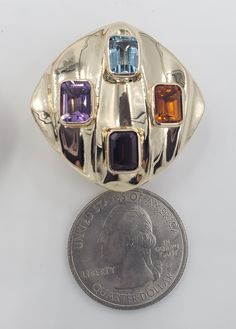 Title: Multicolor Gemstones Round Corner Square 14KT Yellow Gold Omega Clip Earrings Designer: Unbranded Material14KT Stamped Style: Vintage Gemstone Details All measurements are approximate and may vary slightly from the listed dimensions.1ar Approximately 5mm x 4mm each 1Amethyst Rectangular 1 Blue Topaz Rectangular 1 Orange Citrine Rectangular 1 Garnet Rectangular Estimated Measurements of the item30.23mm x 20.23mm x 5.83mm Estimated Total Weight of the Item DWT: 7.6 Grams: 11.7 Condition: Pr Luxury Multicolor Earrings With Gemstone Accents, Luxury Multi-stone Gold Earrings, Gold Multi-stone Gemstones In Fine Jewelry Style, Gold Multi-stone Fine Jewelry Gemstones, Designer Multi-stone Gold Jewelry, Gold Oval Multi-stone Earrings, Luxury Gold Multi-stone Gemstones, Oval Gold Multi-stone Earrings, Multicolor Gemstone Accented Earrings For Formal Occasions