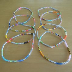 "A set of Two Single Strands stretch bracelets Silver based with multi colored patterns mixed in delicate 11\" seed beads strung on quality stretch cord Mostly Matte Opaque 11\" Japanese Toho seed beads with varying patterns Sold in 3 sizes: 6.0 (X/S) 6.5\" (s/m) and 7\" (m/l) I advise to get the bracelets 1/2\" bigger than actual wrist to ensure they stretch over hand and have a bit of slack when worn. If you need a size up please look at the Men's bracelets which start at 7.5\" and up. Stateme Trendy Stretch Bracelet With Tiny Heishi Beads, Adjustable Colorful Tiny Beads, Colorful Adjustable Tiny Beads, Trendy Multicolor Friendship Bracelets With Tiny Beads, Silver Heishi Beaded Bracelets With Tiny Beads, Silver Heishi Bead Bracelet With Tiny Beads, Silver Heishi Beaded Bracelets With Colorful Beads, Multicolor Flexible Bracelets With Round Beads, Colorful Friendship Bracelets With Tiny Round Beads