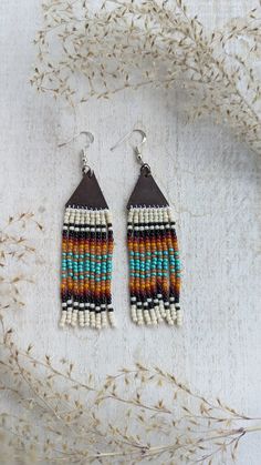 The inspiration behind these earrings was a beautiful sunrise on a lake. These earrings are completely handmade and designed. You can choose gold, silver or bronze hardware. Hardware is hypoallergenic. Approx. 2 1/2 in. long NOTE: IF YOU WOULD LIKE DIFFERENT COLORS PLEASE DO NOT HESITATE TO REACH OUT. WE LOVE CUSTOM ORDERS AND HAVE AN ARRAY OF COLORS. Bohemian Multicolor Hypoallergenic Jewelry, Multicolor Earthy Dangle Earrings, Earthy Multicolor Dangle Earrings, Earthy Handmade Multicolor Earrings, Brown Dangle Earrings With Artsy Style, Bohemian Multicolor Hypoallergenic Earrings, Multicolor Nickel-free Copper Earrings, Nickel-free Multicolor Copper Earrings, Multicolor Copper Dangle Earrings