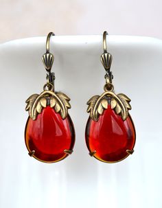 VINTAGE ELEMENTS Unique Jewellery, Handmade from Vintage Inspired Original Designs Fabulous Art Nouveau, Art Deco style antiqued Gold Brass Earrings with Red Teardrop set glass stones and ornate leaf detail. These earrings are made with antiqued brass leverback earwires and measure 3.5cm from the top of the earwires. Vintage Red Teardrop Jewelry, Ornate Red Teardrop Jewelry, Vintage Jeweled Earrings For Gifts, Antique Jeweled Red Jewelry, Vintage Red Brass Earrings, Red Jeweled Metal Earrings, Formal Red Brass Earrings, Antique Jeweled Earrings For Gift, Antique Red Drop Earrings