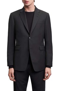 This wool-kissed blazer boasts notched lapels and breezy back vents to keep you moving comfortably. 30" length (size 40 US / 50 EU Regular)   Notched lapels   Nonfunctional four-button cuffs   Back vents   Lined   54% recycled polyester, 44% wool, 2% elastane   Dry clean   Made in Turkey Black Blazer With Welt Pockets For Business Meetings, Wool Tuxedo Blazer With Welt Pockets, Black Wool Blazer With Single Button, Sleek Business Blazer With Lapel Collar, Sleek Single Button Business Outerwear, Black Sport Coat With Notch Lapel For Business Meetings, Black Notch Lapel Sport Coat For Business Meetings, Black Sport Coat For Business Meetings With Notch Lapel, Sleek Business Blazer With Concealed Placket