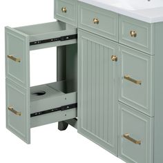 a white sink sitting under a bathroom vanity next to a counter top with drawers underneath it