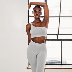 Matching Sets. That’s Los Angeles. Azaire is shown here wearing our 8389GD Garment Dye One Shoulder Crop Top with our 83280GD Garment Dye Legging in Light Grey. Made in South Central, Los Angeles by experienced workers earning fair wages. #thatslosangeles #losangelesapparel #dovcharney #basics #madeinusa Trendy Crop Top With Built-in Bra For Loungewear, Seamless Cropped Sports Bra For Spring, Spring Seamless Cropped Sports Bra, Spring Crop Top With Built-in Bra For Gym, Stretch Cropped Bra For Spring, Cropped Stretch Bra For Spring, Spring Cropped Stretch Bra, Spring Crop Top Sports Bra For Loungewear, Seamless Cropped Sports Bra For Loungewear