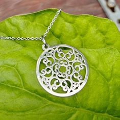 This silver mandala pendant necklace for women is a stunning addition to any jewelry collection. It features a stunning 1.25-inch round circle pendant with an intricate filigree-style cutout design with a mirror finish. Made with 316L stainless steel, it will always maintain its shine without tarnishing, making it perfect for everyday wear, yes, even in the shower. The pendant hangs from a 1.6mm stainless steel cable chain, with a secure lobster clasp. Available in lengths from 16 to 30 inches. Mandala Pendant, Karma Jewelry, Mens Chain Necklace, Cutout Design, Round Circle, Circle Necklace, Coin Necklace, Circle Pendant, Stainless Steel Necklace