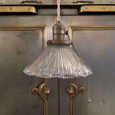 Petite, early 20th century pendant light with fluted glass shade with ruffled edge and brass pull chain hardware is newly wired with tan braided cloth cord to hang 70 inches overall. French Pendant Light, Porcelain Pendant Light, Fluted Glass, Antique Lighting, Industrial Lighting, Pull Chain, Glass Pendant Light, Brass Pendant, Vintage Lighting