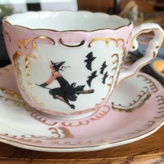 a cup and saucer on a wooden table