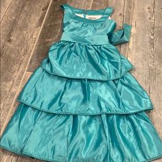 You Can’t Find A Better Tiered Satin Layered Dress For Your Daughters Birthday Party Or A Wedding! Pop Pom Fringe Edge And A Back Hidden Zipper! 100% Polyester Brand New Spring Holiday Dress With Ruffles, Elegant Sleeveless Princess Dress For Holiday, Spring Holiday Dress With Ruffles For Dress-up, Fitted Princess Dress For Holiday In Spring, Spring Sleeveless Princess Dress For Holiday, Sleeveless Princess Dress For Spring Holiday, Spring Holiday Sleeveless Princess Dress, Elegant Tiered Princess Dress For Party, Layer Dress