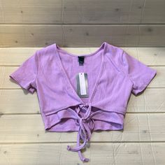 Women’s Wild Fable Short Sleeve Double Tie Versatile Light Lavender Crop Top Nwt Fitted Purple V-neck Crop Top, Fitted V-neck Purple Crop Top, Trendy Purple V-neck Crop Top, Purple Stretch Cotton Crop Top, Purple Stretch Crop Top, Stretch Mauve Tops For Spring, Spring Stretch Mauve Tops, Purple Stretch Crop Top With Short Sleeves, Purple Stretch Top For Spring