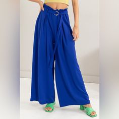 The Paperbag Waist Wide Leg Pants Are A Chic And Trendy Addition To Your Wardrobe. Featuring A Paperbag Waist Design, These Pants Are Flattering And Stylish. The Wide Leg Silhouette Offers A Comfortable And Breezy Fit For All-Day Wear. Pair Them With A Tucked-In Blouse Or Crop Top To Showcase The Unique Waist Detail. These Pants Are Perfect For Both Casual Outings And More Formal Events, Adding A Touch Of Sophistication To Any Outfit. Elevate Your Style With The Fashionable And Versatile Paperba Trendy Blue Belted Bottoms, Blue Paperbag Waist Bottoms With Belt Loops, Blue Wide Leg Pants With Pockets For Day Out, Versatile High Waist Blue Wide Leg Pants, Casual Blue Belted Bottoms, Chic Blue Belted Bottoms, Casual Blue Wide Leg Pants With Belt Loops, Blue Paperbag Waist Bottoms For Spring, High Waist Belted Blue Bottoms