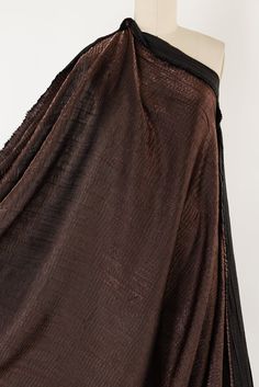 Deep rich brown with a copper shimmer and a vertical and horizontal crinkle, in a sassy deadstock from an LA designer, with a Miyake-esqe vibe. Airy shirting weight is opaque with a softly textured hand and gently crisp sculptural drape. Right for a shirt, top, tunic, dress, skirt, soft pant, kimono, light jacket or vest. poly blend 50" Luxury Crinkle Texture Dresses, Chic V-neck Dress With Crinkle Texture, Eco Fabric, Soft Pants, Solid & Striped, Pant Shirt, Light Jacket, Coat Dress, Autumn Summer