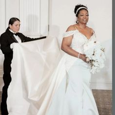 a woman in a wedding dress holding a white bouquet next to a man in a tuxedo