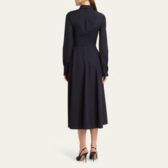 Valentino Garavani crepe shirtdress featuring a neck scarf and a goldtone V-logo belted waist Point collar; concealed button front Long sleeves; button cuffs Side split pockets Hem falls below the knee A-line silhouette Virgin wool/elastane Made in Italy Classic Button-up Shirt Dress For Formal Occasions, Classic Midi Dress With Placket For Daywear, Formal Shirt Dress With Button Cuffs And Spread Collar, Formal Shirt Dress With Spread Collar And Button Cuffs, Semi-formal Shirt Dress With Spread Collar And Button Cuffs, Elegant Collared Midi Dress With Placket, Formal Shirt Dress With Spread Collar And Placket, Elegant Shirt Dress With Button Cuffs And Spread Collar, Classic Spread Collar Dress For Work