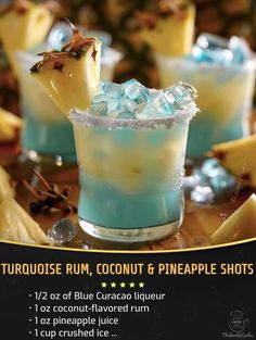 two glasses filled with blue curacade and pineapple shots