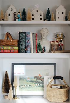 the shelves are filled with books and other things to decorate on top of each shelf