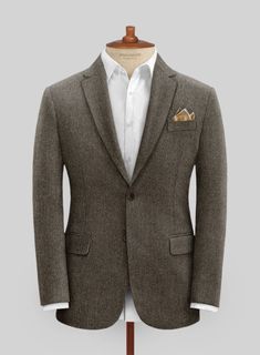 A classic design with a modern silhouette, our Tweed Suit is a must-have for every modern gentleman. Crafted from wool, the unique tweed fabric characterized by its herringbone weave structure that is famous for its warmth and durability makes this suit an ideal transitional piece for a wedding, gala, or prestigious evening event, where you seek to leave a lasting impression, this jacket is the epitome of polished refinement.  Look Includes   Vintage Dark Brown Herringbone Tweed  Horn Brown Butt Grey Tweed Suit, Herringbone Tweed Jacket, White Linen Suit, Green Velvet Jacket, Peaky Blinders Suit, Royal Blue Suit, Tweed Suit, Blue Chinos, Herringbone Tweed