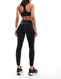 Pants & Leggings by Nike Training Training is now in session High rise Elasticized waistband Logo print on hem bodycon fit Black Micro-elastic Pants, Black Athleisure Bottoms With Contoured Waistband, Black Compressive Mid-rise Tights, Black Compressive Athleisure Bottoms, High Rise Black Bottoms For Pilates, Compression Elastane Bottoms For Training, High Rise Black Elastane Tights, High Stretch Bottoms With Ribbed Waistband For Training, Tight Black Pants For Pilates