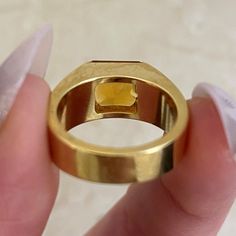 This unique ring features a natural citrine stone in a square cut. This ring is handcrafted in 18k yellow gold and signed by Cartier.
The approximate measurements of the citrine are 8.06mm x 7.92mm x 5.50mm.
This ring is currently sized at 5 and can be resized at no additional cost.
Ready to Make It Yours? Contact us to reserve this ring and to get more info! Luxury Square Cut Sapphire Ring, Luxury Gold Topaz Ring, Modern Gold Topaz Ring, Luxury Gold Topaz Ring With Polished Finish, Modern Gold Ruby Ring With Polished Finish, Luxury Rectangular Ruby Ring, Luxury Citrine Topaz Ring With Emerald Cut, Modern Yellow Gold Citrine Ring, Modern Gold Asscher Cut Ring