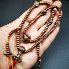 ❤This mala was collect from Hepo Town Baiyu County Tibet, blessed in Yaqing Monastry.It is made of copper,brown color,length is 44cm / 18",has 1 Kartika ,2 skeletons, 2 stamp pendant, and 2 strings of counters with phurba + kartika.❤DETIALS100% HandmadeMaterial:red copperSize:Mala'perimeter is 44cm,18 inches.108 bodhi beads: 5mm ,about 0.2"1 kartika:2.7cm ,about 1.1"2 skull beads:1.1cm * 1.1cm ,about 0.43" * 0.43"2 counters: 6cm long, about 2.36"❤ Great Mala For Meditation and Yoga Practitioners Hand-strung Brown Necklaces For Rituals, Brown Hand-strung Necklaces For Rituals, Bronze Spiritual Necklaces For Rituals, Brown Amulet Necklace With 108 Beads, Brown Necklace With 108 Beads For Festivals, Adjustable Copper Spiritual Necklaces, Spiritual Adjustable Copper Necklace, Bronze Spiritual Necklaces For Festivals, Spiritual Bronze Necklaces For Festivals