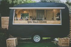 an old trailer converted into a mobile home with the words little black caravan written on it