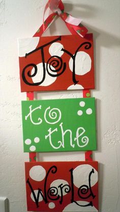 two red and green signs hanging on a wall with the words to the woof