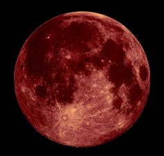 the full moon is shown in red and black