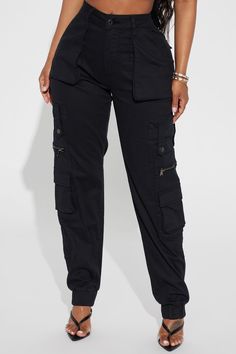 Available In Black. Jogger Fit Pant Button & Zipper Front Closure Functional Cargo Pockets Throughout 29.5" Inseam Faux Back Pockets Elasticized Ankle Jogger Hem Medium Stretch Twill 98% Cotton 2% Spandex Imported | Exotica Cargo Jogger Pant in Black size Medium by Fashion Nova Black Bottoms With Button Closure For Streetwear, Black Pants With Button Closure For Streetwear, Fitted Streetwear Bottoms With Button Zip Fly, Fitted High Waist Cargo Pants With Button Closure, Black High-rise Bottoms With Button Zip Fly, Casual Black Bottoms With Button Zip Fly, Trendy Black Bottoms With Button Zip Fly, Utility Bottoms With Button Zip Fly For Fall, Mid-rise Black Pants With Button Zip Fly