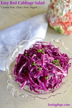 red cabbage salad in a glass bowl on a table