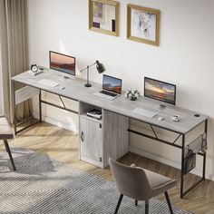 a computer desk with two laptops on it and a chair in front of it