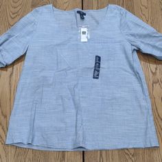 Lightweight Blouse. Blue. Gap Summer Workwear Shirt, Gap Shirt For Summer Workwear, Gap Summer Workwear Top, Gap Tops For Summer Workwear, Chic Cotton Blouse By Gap, Gap Short Sleeve Spring Blouse, Gap Light Blue Cotton Tops, Gap Short Sleeve Blouse For Spring, Chic Gap Blouse For Work