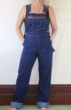 Vintage 1990s dark wash long overalls.  In excellent vintage condition  Fabric: Cotton   Size: 10 Australian  Measurements  Length: 160cm (adjustable) Waist: 78cm Hips: 94cm Rise: 34cm Postage Standard postage $10.00 or Express postage within Australia $13.00. DM for a quote on combined postage, international buyers please email for a quote if postage costs are not specified. Vintage Dark Wash Bib Front Overalls, Retro Dark Wash Denim Jumpsuit, Vintage Dark Wash Overalls With Pockets, Retro Dark Wash Bib Front Overalls, Vintage Dark Wash Denim Jumpsuit With Straight Leg, Vintage Dark Wash Straight Leg Denim Jumpsuit, Long Overalls, Womens Overalls, Overalls Women