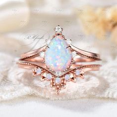 Opal Wedding Ring, Elegant Ring, Anniversary Gift For Women, Antique Ring Product Detail Main Ring Material: 10k/14k/18k Solid Rose/White/Yellow Gold Center Stone: 6x8mm Pear Cut Lab Opal Side Stones: Round Cut Moissanites Wedding Band Material: 10k/14k/18k Solid Rose/White/Yellow Gold Gemstones: Round Cut Lab Opal Custom Service 1, Gemstones can be replaced with others. 2, All metal can be made. 3, All ring size can be customized. 4, Engraving word service is available. 5, The ring can be made White Diamond Wedding Birthstone Ring, White Diamond Birthstone Ring For Wedding, Rose Gold Birthstone Ring With Diamond Accents For Wedding, Moissanite Birthstone Ring For Wedding, Wedding Rose Gold Birthstone Ring With Diamond Accents, Cubic Zirconia Opal Ring For Anniversary, White Opal Ring, Pear-shaped For Wedding, Yellow Gold Pear-shaped Opal Ring For Wedding, White Birthstone Ring With Accent Stones For Wedding