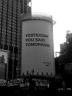 an advertisement on the side of a water tower for nike in new york city's times square