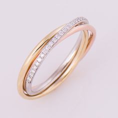 two tone gold and white diamond wedding ring, set with three rows of diamonds on each band