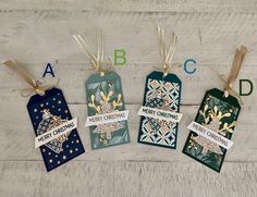 four tags with christmas designs on them