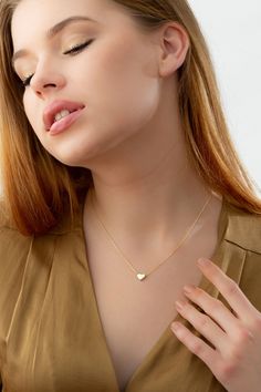 Tiny Gold Heart Necklace, 14k 18k Solid Gold Necklace Pendant, Minimalist Love Necklace Romantic Gift for Wife and Girlfriend, Heart Jewelry FEATURES * Solid Gold (real gold, not gold plated or gold filled material) * Gold Karat: 10K (417) - 14K (585) - 18K (750) (optional) * Pendant Height: * Pendant Width: * Available Gold Color: Yellow gold, rose gold and white gold (optional) * Necklace length: 14-16-18-20-22-24 inches Wholesale requests are welcome. Our gold necklaces are perfect choice for Minimalist Double Heart Gold Plated Necklace, Tiny Heart Pendant Charm Necklace, Delicate Yellow Gold Heart Necklace, Wedding Heart Necklace With Delicate Chain, Minimalist Gold Plated Heart Necklace With Delicate Chain, Minimalist Gold-plated Heart Necklace With Delicate Chain, Minimalist Gold Plated Double Heart Necklace, Minimalist Gold-plated Double Heart Necklace, Minimalist Double Heart Gold-plated Necklace