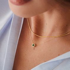 Green is a color that represents rebirth, good fortune, and youth. You can express your feelings or let the right vibe in with this green birthstone necklace. 14k solid gold handcrafted pieces 100% ethical sourced jewelry Material: 14k Solid Gold Diamond Quality:Carat Weight: 0.03 ctwColor: F-GClarity: VS2Cut: Excellent Emerald carat: 0.3 ctw Pendant Height: 6 mm / 0.23 inch Pendant Width: 6 mm / 0.23 inch Chain Style: Cable Chain Chain Length: 18 inch Emerald Halo, Halo Necklace, Gold Diamond Necklace, Emerald Necklace, Unique Diamonds, Birth Month, Birthstone Necklace, Cable Chain, Chain Styles