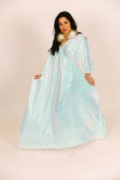 Be the life of the party in this long sequin caftan! This show-stopping caftan is adorned with shimmering sequins that will catch the light and turn heads. With a flowy, relaxed fit, it combines style and comfort. The long length ensures you'll bring the fashion drama, while the sequins add a touch of glamour to your look. These comfortable sequins on mesh are ulined for maximum breeze. Sequined Summer Evening Kaftan, Sequin Kaftan For Evening And Summer, Sequined Kaftan For Evening In Summer, Summer Evening Kaftan With Sequins, Summer Festive Sequined Kaftan, Bohemian Sequin Kaftan For Parties, Spring Party Kaftan With Sequins, Oversized Maxi Party Dress, Summer Party Sequined Kaftan