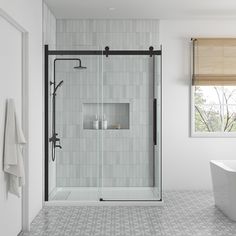 a white bath tub sitting next to a walk in shower