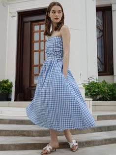 This is HYBERNAT’s maxi dress offers a lovely look with its checkered pattern, adding a cheerful vibe to your outfit. The off-shoulder design allows you to create a feminine mood. With smocked banding at the back, it offers great stretchability for comfortable wear.- Perfect for daily wear- Can be paired with various styles of accessories to create different looks- The checkered pattern serves as the focal point of the outfit Summer Plaid Dress With Smocked Bodice, Gingham Dress With Smocked Back For Garden Party, Chic Smocked Bodice Dress For Picnic, Gingham Dress With Smocked Bodice For Garden Party, Chic Dresses With Smocked Bodice For Picnic, Spring Gingham Sleeveless Maxi Dress, Gingham Midi Length Dress For Picnic, Gingham Midi Dress For Picnic, Spring Plaid Dress For Garden Party