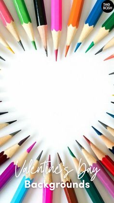 there are many different colored pencils arranged in the shape of a heart with text valentine's day background