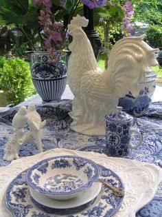 a table topped with blue and white dishes