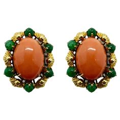 Elevate your jewelry collection with these stunning 18k Yellow Gold Cabochon Orange Stone and Emerald Earrings. Crafted from 18k yellow gold, these earrings feature a beautiful cabochon orange stone and approximately 2.50 carats of emeralds. With a length of 1 inch, they are perfect for any occasion. Add a touch of vintage glamour to your look with these 1960's earrings. "18k" markings assure quality and the lightweight of 21.7 grams creates comfortable wear. 18k Yellow Gold Cabochon Orange Stone and Emerald Earrings Condition: In good condition with some minor surface wear consistent with age. Period: 1960's Length: 1 inch Markings: "18k" Metal: 18k Yellow Gold Weight: 21.7 grams Emerald ~2.50 carats 1960s Earrings, Orange Stone, Emerald Earrings, Vintage Glamour, Shop Earrings, 1 Inch, Etsy Earrings, Jewelry Collection, 1960s