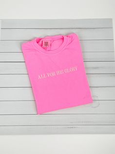 All for his glory Crewneck T-shirts! Super adorable Faith Based Crewnecks! You can customize the shirt color and thread colors!  **THIS LISTING IS FOR ONE TSHIRT** The "ALL FOR HIS GLORY" shirt pictured is NEON PINK with CREAM Thread These are embroidered on comfort colors shirts UNISEX FIT  SHORT SLEEVE 100% RINGSPUN COTTON Want a different color? Checkout our shop for other color options!  Want a different word? Just message us & we will let you know if we can! If you have any questions at all Cute Christian Shirt Designs, Embroider Shirt Ideas, Pink Crew Neck T-shirt With Embroidered Graphics, Pink Crew Neck Top With Embroidered Logo, Pink Crew Neck Top With Embroidered Text, Pink Crew Neck T-shirt With Embroidered Text, Pink Embroidered Text Crew Neck T-shirt, Pink Short Sleeve Tops With Embroidered Text, Pink Short Sleeve T-shirt With Custom Embroidery