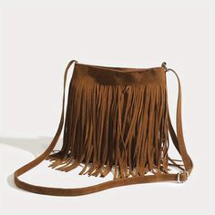 Discover the Ultimate Bohemian Accessory Introducing the perfect blend of style and functionality—our Vintage Suede Fringe Crossbody Bag. This exquisite shoulder bag embodies the essence of bohemian chic, elevating any outfit with its sophisticated flair and playful tassels. Designed for the modern woman who cherishes both elegance and convenience, this bag is a must-have accessory that complements every occasion, from the laid-back to the lavish. Key Features Charming Bohemian Style: Elevate your wardrobe with the bag’s elegant boho aesthetics. Trendy Tassel Decoration: Add a playful touch to your ensemble with chic, eye-catching tassels. Soft and Durable Material: Crafted from premium PU leather, offering both comfort and durability for daily use. Adjustable Shoulder Strap: Custom-fit to Beg Tangan, Boho Crossbody Bag, Tassel Purse, Fringe Crossbody Bag, Bohemian Accessories, Fringe Bags, Vintage Suede, Estilo Chic, Design Del Prodotto