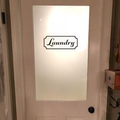 a white door with the name laundry on it's glass paneled front door