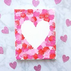 pink and red heart shaped painting on white paper