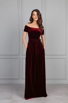 Dark Burgundy Velvet Dress, Bridesmaid Dress, Off The Shoulder Dress, Wedding Guest Dress, Evening Dress, Velvet Long Dress, Formal Dress. This dress is perfect for any occasion- can be like a bridesmaid dress, wedding guest dress, evening gown, mother of the bride dress, evening dress, reception dress, maid of honor dress or simple wedding dress. More Velvet dresses you can find here: https://www.etsy.com/shop/DesirCouture?ref=shop-header-name&listing_id=1164808298&from_page=listing&section_id= Floor-length Wedding Dresses With Sashes, Fitted Red Dresses With Sashes, Red Fitted Dress With Sashes, Couture Bridesmaid Dresses, Velvet Dress Maxi, Burgundy Velvet Dress, Velvet Bridesmaid Dresses, Velvet Dress Long, Burgundy Bridesmaid