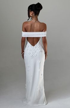 the back of a woman in a white dress